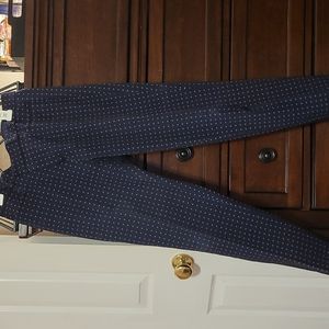 Navy Sloan pants with coral design throughout.